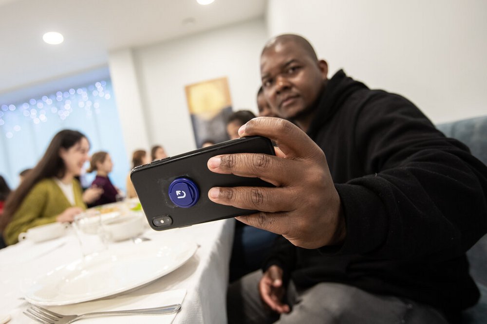 a dark-skinned student during the Christmas Eve dinner of the University of Lodz ​