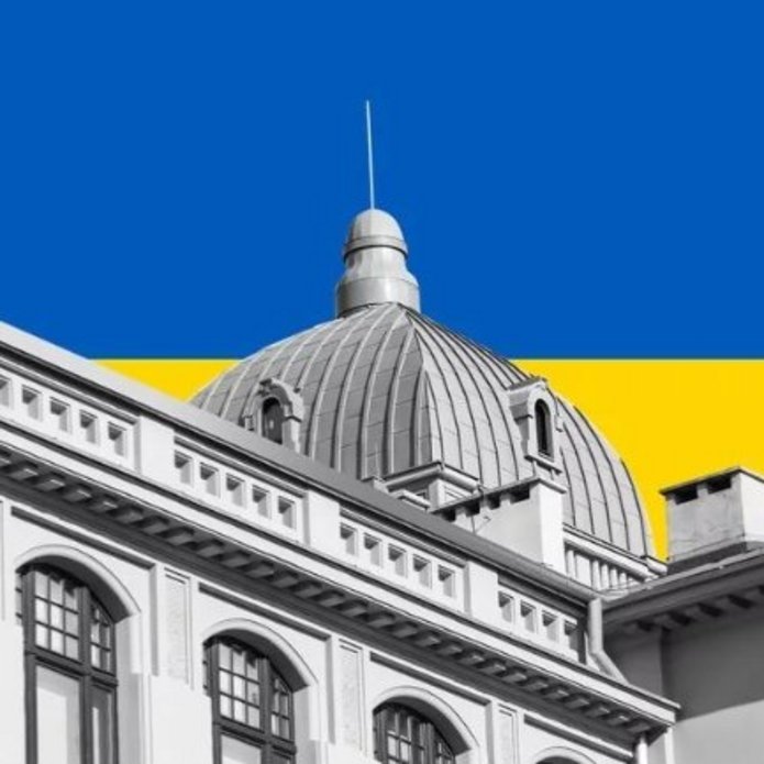 A building on the background of the Ukrainian flag