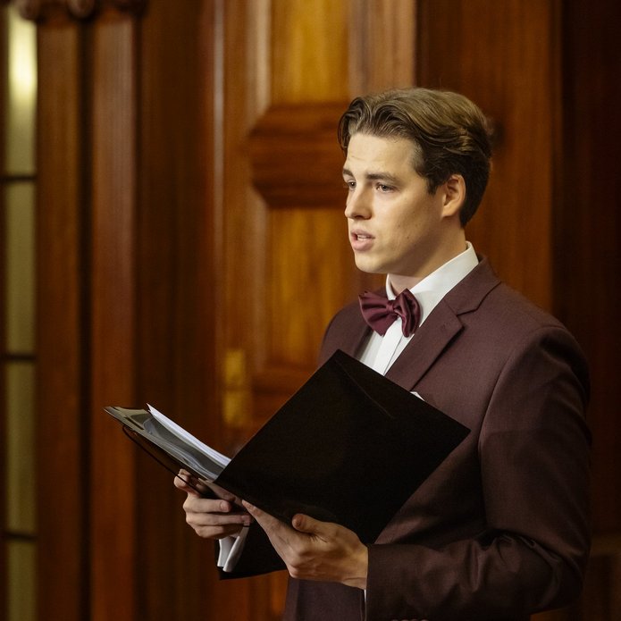 a young man who is performing