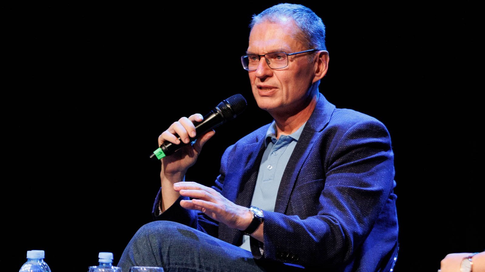 a photo of Andrzej Poczobut with a microphone