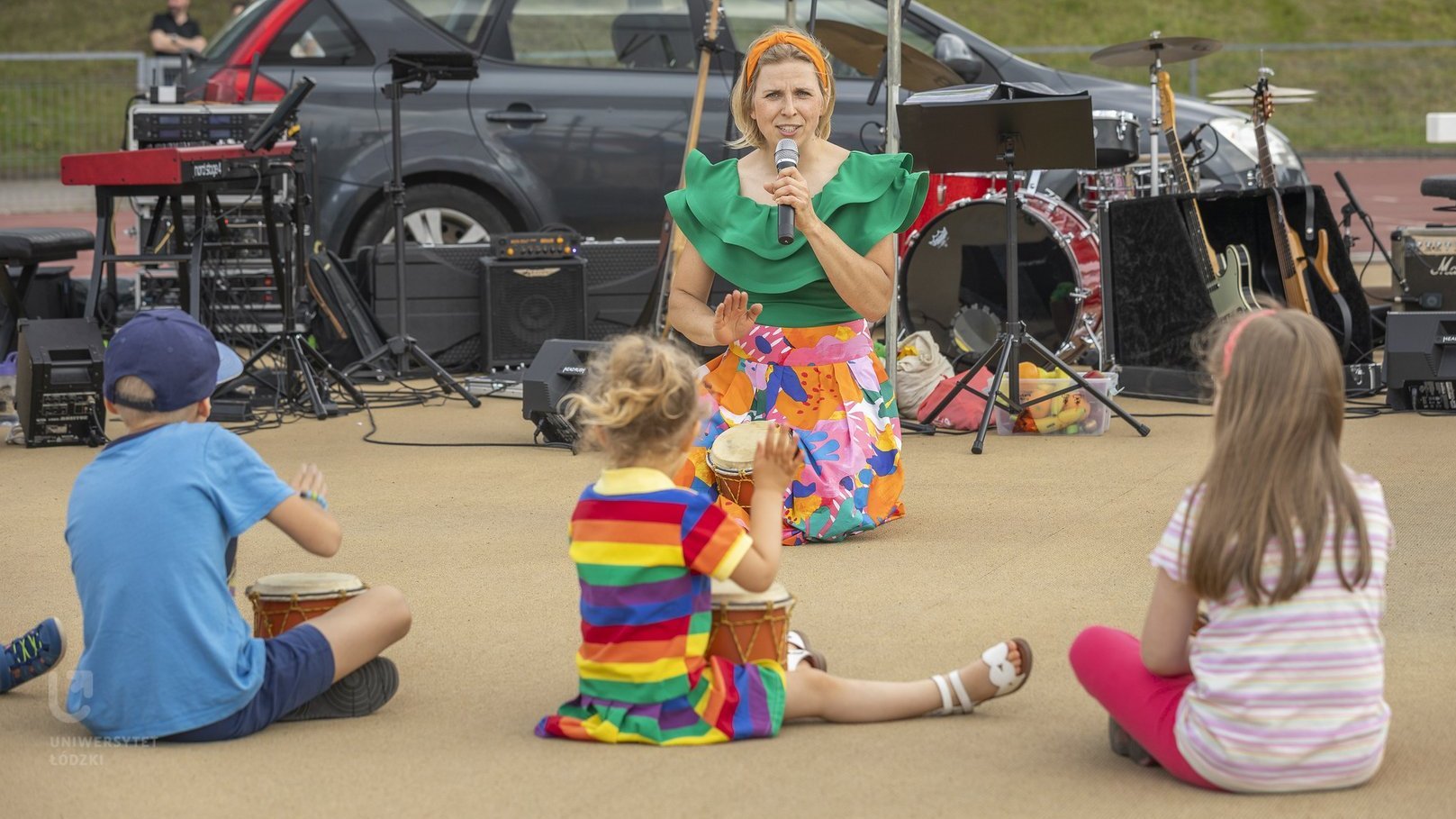 Children sitting and listening to a concert