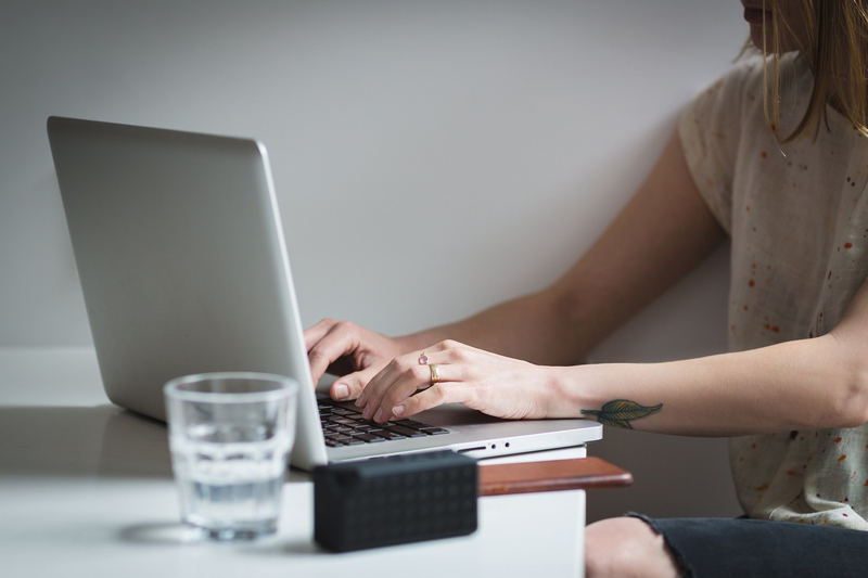 A girl typing on a laptop keyboard A girl typing on a laptop keyboard