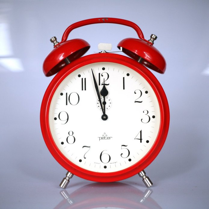 A red alarm clock