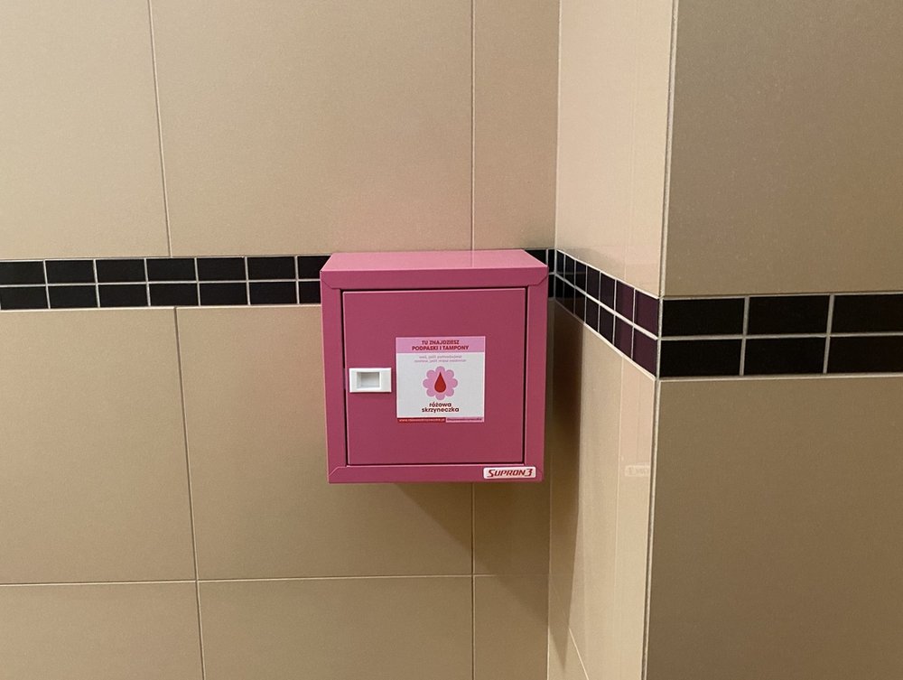 A pink box hanging on the wall