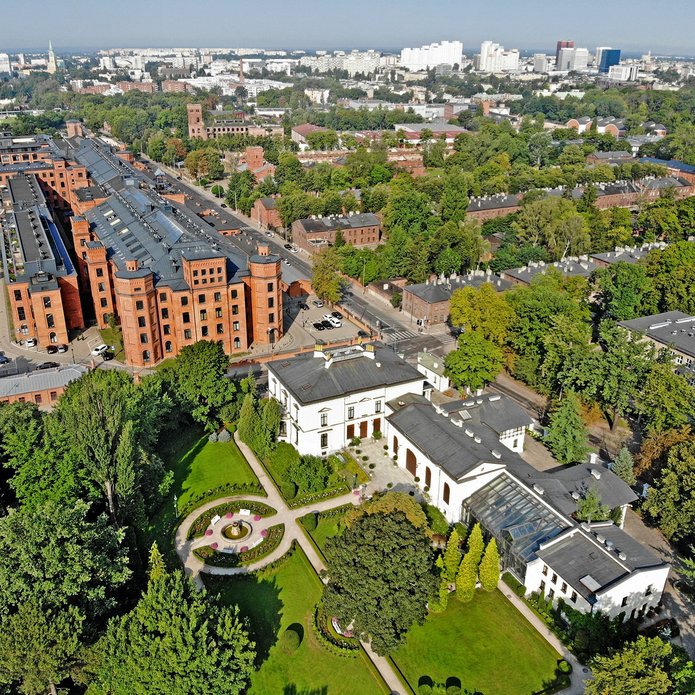 Lodz from a bird's eye view, with Herbst Palace and green areas in the frame