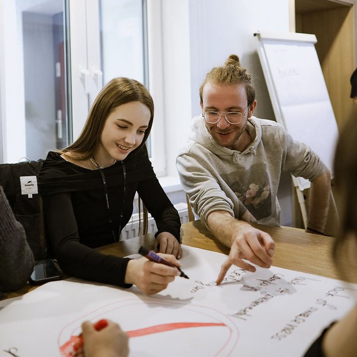 a decorative element: two young people working on something together