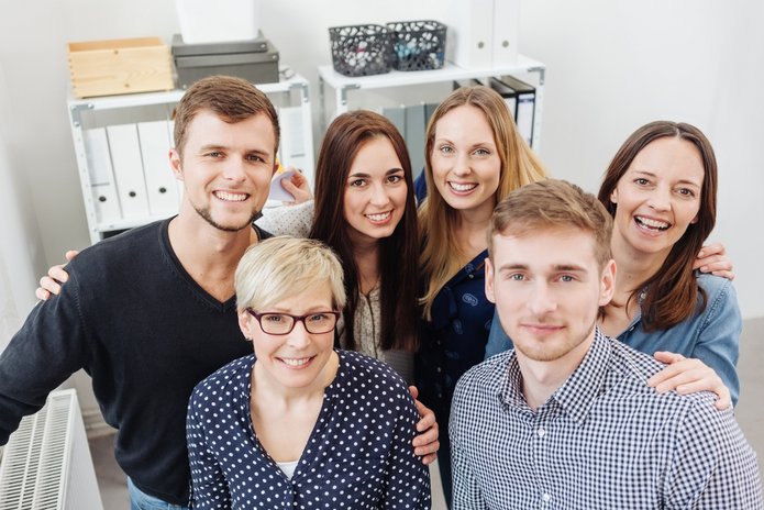 a decorative element: a group of office colleagues posing for a photo