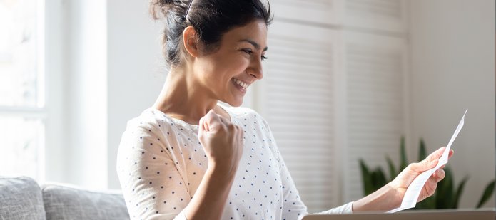 A student reads a letter that contains good news.