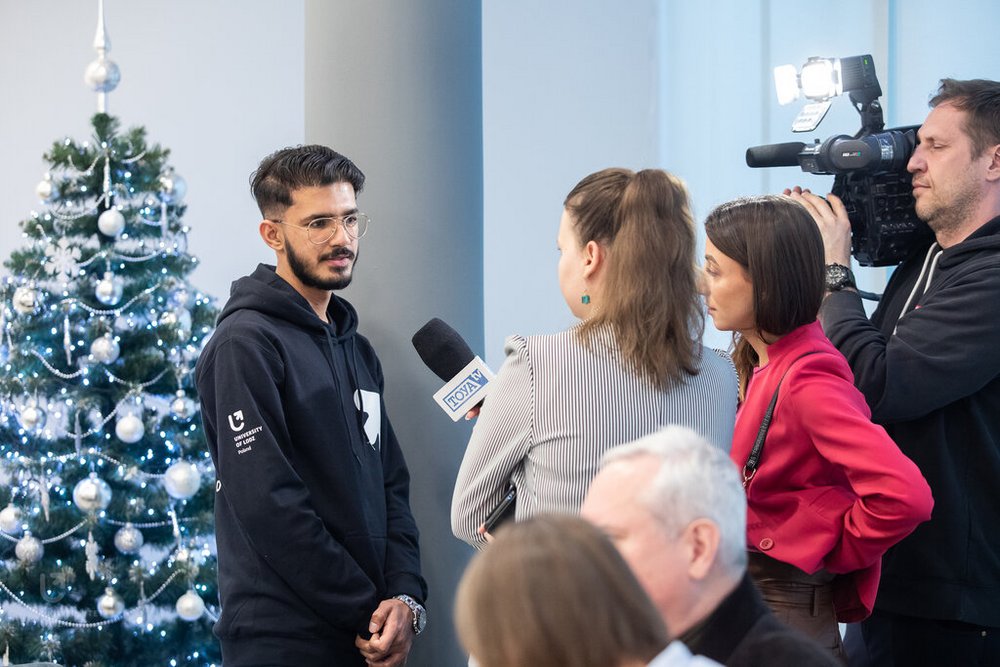 the University of Lodz student wearing a black sweatshirt during an interview for TOYA TV
